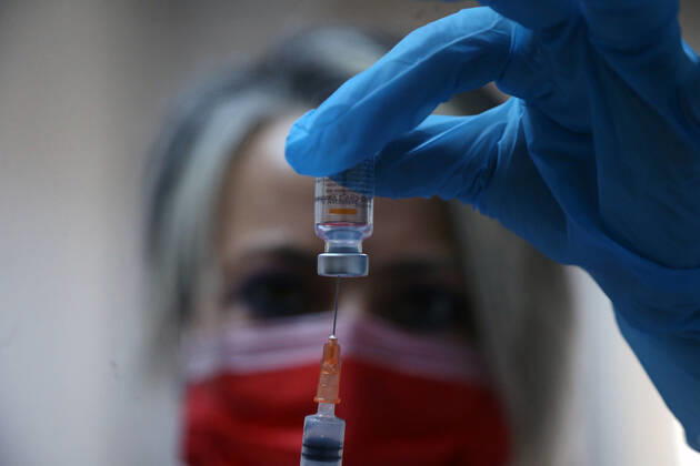 (210116) -- ANKARA, Jan. 16, 2021 -- A medical worker prepares a dose of China s Sinovac COVID-19 vaccine at the Sabiha Uzun Maternal Child Health Center in Ankara, Turkey on Jan. 15, 2021. More than 600,000 health workers in Turkey have received their first doses of COVID-19 shots developed by China s Sinovac during the first two days of the country s vaccination program, Turkish Health Ministry s data showed on Friday. (Photo by Xinhua) TURKEY-ANKARA-HEALTH WORKER-COVID-19-VACCINATION MustafaxKaya 