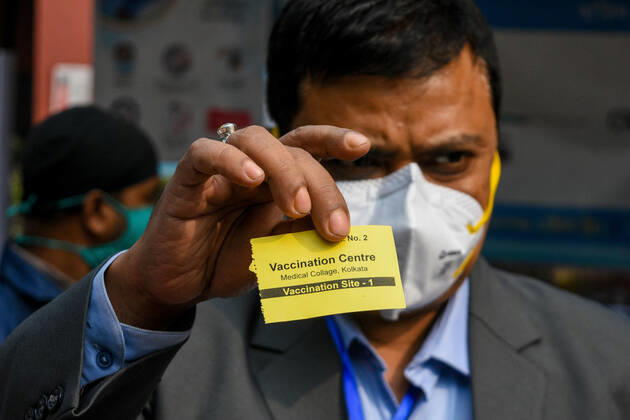 January 16, 2021, Kolkata, West Bengal, India: A Doctor shows his entry pass into the vaccination room which was given to him after verification of his identity and registration.With urgent effect , COVID vaccination drives starts in India from 16th of January 2021.The vaccination progrmae are allotted exclusive to the frontline health workers in its first phase of vaccine drive. As of now, COVISHIELD and COVAXIN has been approved by Indian government for use for vaccination. Kolkata India - ZUMAc211 20210116_zip_c211_001 Copyright: xDebarchanxChatterjeex
