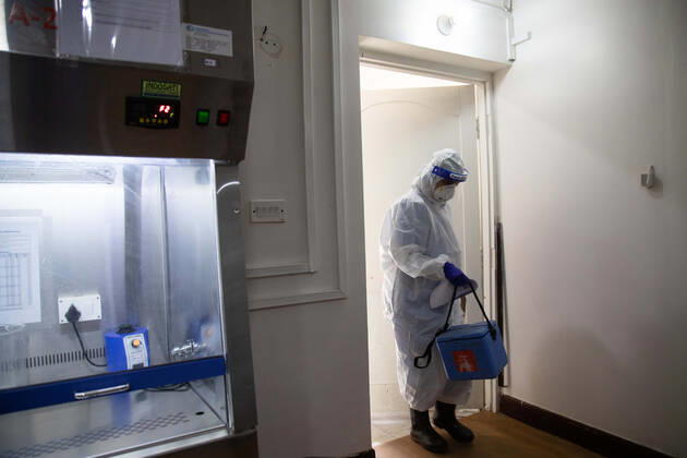 January 18, 2021, Kathmandu, Nepal: A laboratory technologist Srijana Adhikari wearing a personal protective equipment (PPE) enters the lab with collected COVID-19 Swab samples before processing them at the Bidh Lab..Nepal has confirmed that a new variant of coronavirus has entered Nepal as well. Issuing a statement on Monday the Ministry of Health and Population stated that three out of six people who arrived here from the UK a few days ago are found infected with the new variant. Kathmandu Nepal - ZUMAs197 20210118_zaa_s197_110 Copyright: xPrabinxRanabhatx