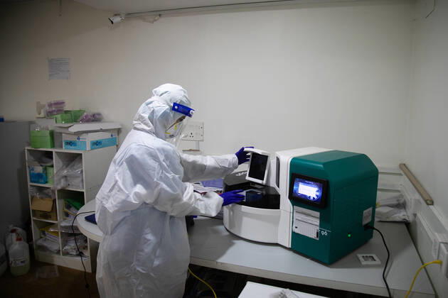 January 18, 2021, Kathmandu, Nepal: A laboratory technologist Srijana Adhikari wearing a personal protective equipment (PPE) seen processing the COVID-19 samples at the Bidh Lab..Nepal has confirmed that a new variant of coronavirus has entered Nepal as well. Issuing a statement on Monday the Ministry of Health and Population stated that three out of six people who arrived here from the UK a few days ago are found infected with the new variant. Kathmandu Nepal - ZUMAs197 20210118_zaa_s197_112 Copyright: xPrabinxRanabhatx