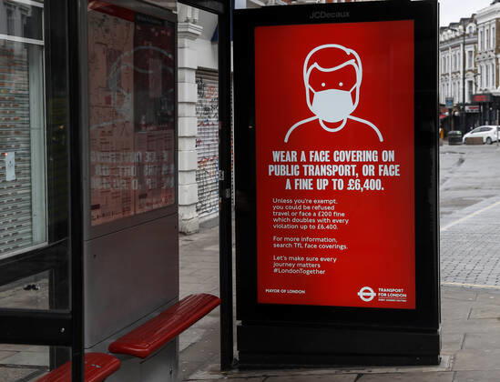 (210120) -- LONDON, Jan. 20, 2021 -- A public notice asking passengers to wear a face covering is seen at a bus stop in London, Britain, on Jan. 19, 2021. The number of people who have died within 28 days of a positive coronavirus test has surpassed the grim milestone of 90,000 in Britain after another 1,610 were confirmed, according to official figures released Tuesday. The latest daily death toll, the highest since the pandemic began in the country, brought the total number of coronavirus-related deaths in Britain to 91,470, the data showed. ) BRITAIN-LONDON-COVID-19-DEATH TOLL HanxYan