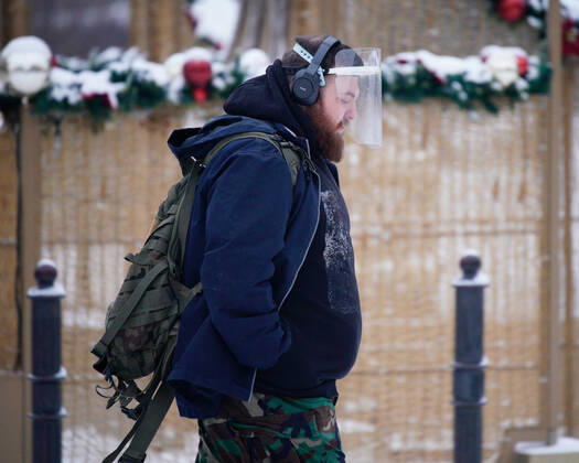 (210120) -- WARSAW, Jan. 20, 2021 -- A man wearing a plastic face shield is seen in Warsaw, Poland, on Jan. 19, 2021. (Photo by Xinhua) POLAND-WARSAW-DAILY LIFE JaapxArriens 