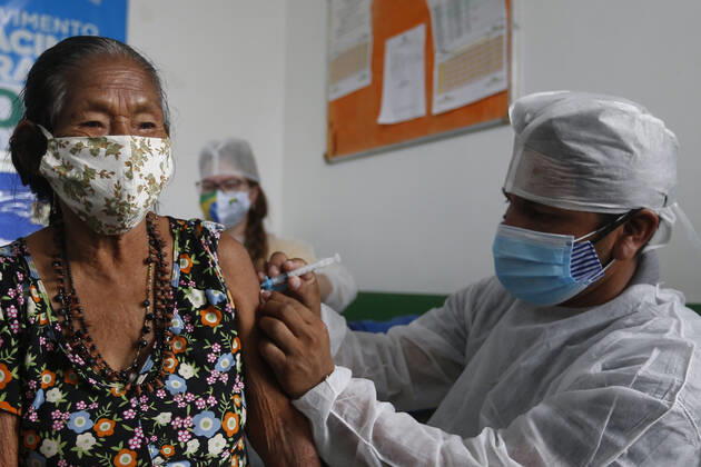 (210120) -- AMAZONAS, Jan. 20, 2021 -- A woman receives a dose of China s COVID-19 vaccine in the city of Tabatinga in the state of Amazonas, Brazil, Jan. 19, 2021. Brazil launched a mass immunization campaign against the COVID-19 pandemic in every state starting at 5:00 p.m. Monday local time (2000 GMT). As of Monday afternoon, all states were expected to have received their doses of the CoronaVac vaccine developed by Chinese laboratory Sinovac in collaboration with the Butantan Institute of Sao Paulo, one of the world s leading scientific research centers. (Photo by Xinhua) BRAZIL-AMAZONAS-COVID-19-VACCINE-MASS INOCULATION LucioxTavora 