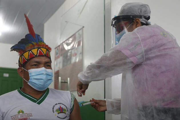 (210120) -- AMAZONAS, Jan. 20, 2021 -- A man receives a dose of China s COVID-19 vaccine in the city of Tabatinga in the state of Amazonas, Brazil, Jan. 19, 2021. Brazil launched a mass immunization campaign against the COVID-19 pandemic in every state starting at 5:00 p.m. Monday local time (2000 GMT). As of Monday afternoon, all states were expected to have received their doses of the CoronaVac vaccine developed by Chinese laboratory Sinovac in collaboration with the Butantan Institute of Sao Paulo, one of the world s leading scientific research centers. (Photo by Xinhua) BRAZIL-AMAZONAS-COVID-19-VACCINE-MASS INOCULATION LucioxTavora 