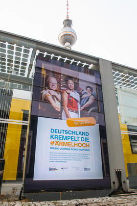 Health Corona Virus Vaccination Campaign Advertisement of the Federal Ministry of Health, the Robert Koch Institute and the Federal Centre for Health Education for the Corona vaccination on a digital billboard at Alexanderplatz 20 1 2021, Berlin, Germany