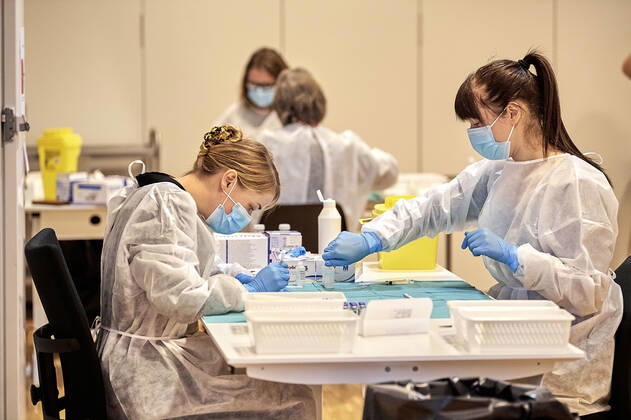 The vaccine is mixed before it is distributed to the residents at Plejecenter Faelledgaarden.  Copyright: NILSxMEILVANG NilsxMeilvangx cop102 spdk20210123-112906-L