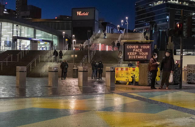 January 23, 2021, London, United Kingdom: People are seen by the COVID sign read Ã¢â‚¬oeCover your face. Keep your distanceÃ¢â‚¬Â in Stratford, the London Borough of Newham, England, UK on January 23, 2021. Some of England s Covid hotspots are still in London Hounslow, Ealing, Brent, Barking and Dagenham and Newham are the boroughs which fall in the country s top 10 for worst case rates. London United Kingdom - ZUMAj323 20210123_zip_j323_014 Copyright: xMayxJamesx