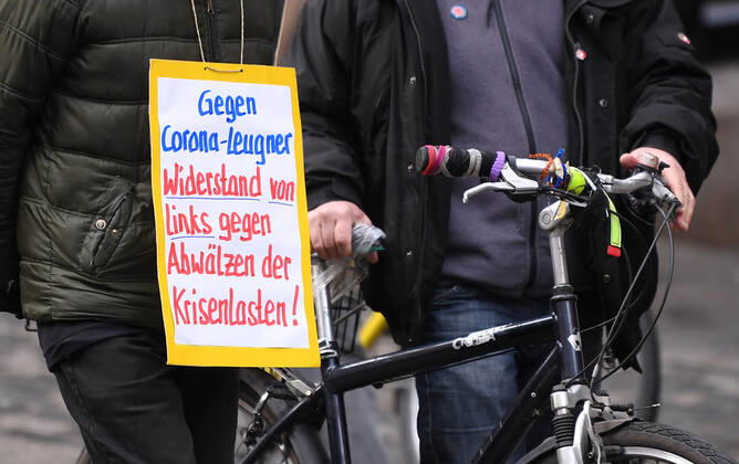 Tuebingen 23 01 2021 Theme picture, demonstrator with banner in Tuebingen city centre Against Corona deniers, resistance from the left against those who are rolling off the burden of the crisis ulmer