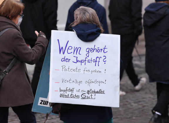 Tuebingen 23 01 2021 Theme picture, demonstrator with banner in Tuebingen city centre Who owns the vaccine Release patents Disclose contracts Vaccine is a global public good ulmer