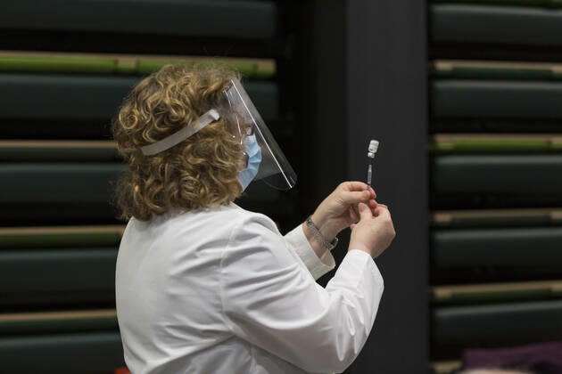 January 24, 2021, Seattle, Washington, U.S: SHARON WATTS, a nurse manager with with Virginia Mason, prepares to give an injection to a patient at a pop up COVID-19 vaccine clinic at the Amazon Headquarters in Seattle on Sunday, January 24, 2021. Amazon partnered with Virginia Mason Franciscan Health to vaccinate 2,000 Washingtonians who currently qualify to be vaccinated under the stateÃ¢â‚¬â ¢s COVID-19 Vaccine Phases guidelines. Seattle U.S. - ZUMAg235 20210124_zap_g235_013 Copyright: xPaulxChristianxGordonx