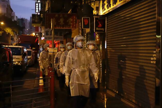 January 25, 2021, Hong Kong, CHINA: Government staffs in full protective gear are called in for duty early this morning, assigned to check local residents who are released from restricted zone after 48 hours of partial lockdown has been lifted.Jan-25,2021Hong Kong.ZUMA Hong Kong CHINA - ZUMAl137 20210125_zap_l137_001 Copyright: xLiauxChung-renx