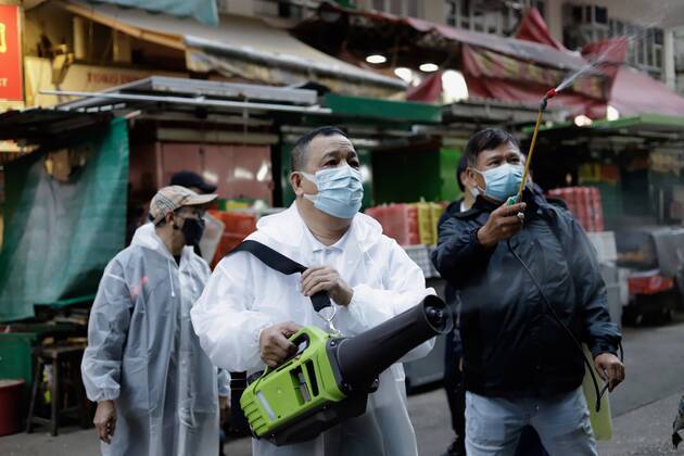 January 25, 2021, Hong Kong, CHINA: Team of volunteers sanitizing Yau Ma Tei Wet Market with fumes and sprays after partial lockdown has been lifted which lasted for 48hrs in the restricted area.Jan-25,2021Hong Kong.ZUMA Hong Kong CHINA - ZUMAl137 20210125_zap_l137_004 Copyright: xLiauxChung-renx