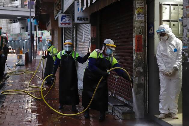 January 25, 2021, Hong Kong, CHINA: Workers sanitize the pavement on Shanghai Street in Yau Tsim Mong District in the early morning after HK government have lifted partial lockdown which lasted for 48hrs.Jan-25,2021Hong Kong.ZUMA Hong Kong CHINA - ZUMAl137 20210125_zap_l137_006 Copyright: xLiauxChung-renx