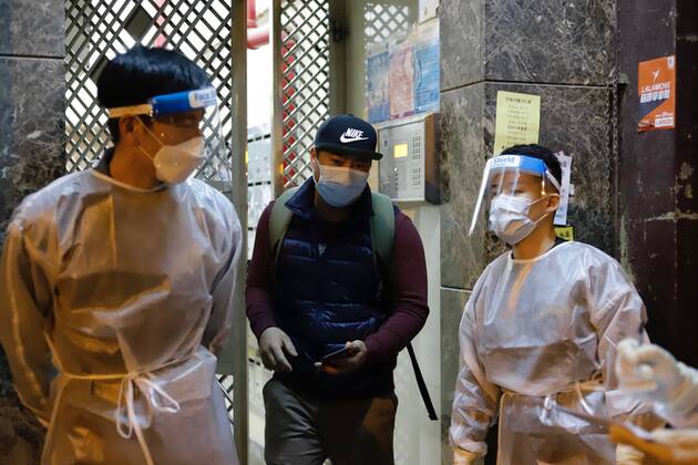 January 25, 2021, Hong Kong, CHINA: Nepali man exit from his residential building after proven Covid-19 Negative by government staff manning the gate.Hong Kong government have lifted partial lockdown on Yau Tsim Mong District after imposing 48 hours of restriction order upon citizens living in the designated zone.Jan-25,2021Hong Kong.ZUMA Hong Kong CHINA - ZUMAl137 20210125_zap_l137_007 Copyright: xLiauxChung-renx