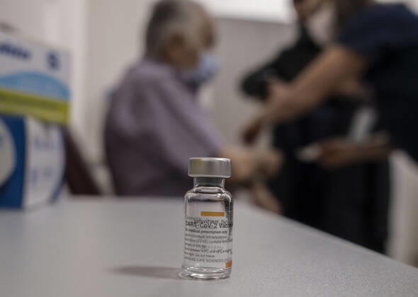 (210127) -- ISTANBUL, Jan. 27, 2021 -- A man receives a dose of COVID-19 vaccine in Istanbul, Turkey, Jan. 27, 2021. A state hospital in Turkey s largest city Istanbul Wednesday was filled with senior citizens who came to be vaccinated against COVID-19 as part of the ongoing mass inoculation program in the country. TO GO WITH Feature: Turkish seniors hope pandemic to end with COVID-19 vaccines (Photo by Xinhua) TURKEY-ISTANBUL-VACCINATION OsmanxOrsal 