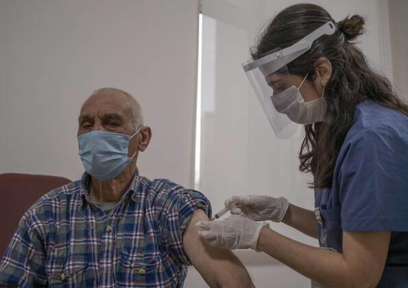 (210127) -- ISTANBUL, Jan. 27, 2021 -- A man receives a dose of COVID-19 vaccine in Istanbul, Turkey, Jan. 27, 2021. A state hospital in Turkey s largest city Istanbul Wednesday was filled with senior citizens who came to be vaccinated against COVID-19 as part of the ongoing mass inoculation program in the country. TO GO WITH Feature: Turkish seniors hope pandemic to end with COVID-19 vaccines (Photo by Xinhua) TURKEY-ISTANBUL-VACCINATION OsmanxOrsal 