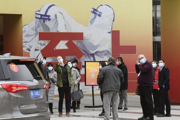WHO probe into coronavirus origins in Wuhan Members of the World Health Organization s team investigating the origins of the coronavirus pandemic visit an exhibition about China s fight against the virus on Jan. 30, 2021, in Wuhan. 