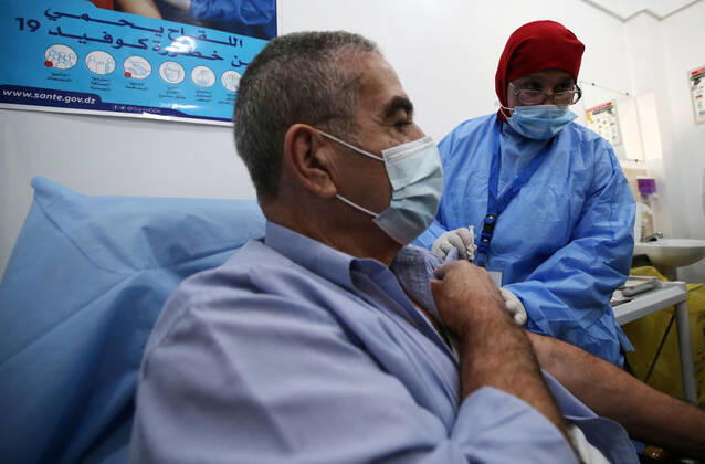 (210131) -- ALGIERS, Jan. 31, 2021 () -- A man receives an injection of COVID-19 vaccine at a clinic in Algiers, Algeria, Jan. 31, 2021. Algeria on Sunday reported 217 new COVID-19 cases, raising the total infections in the North African country to 107,339. Algeria s COVID-19 vaccination kicked off on Jan. 30 in the town of Blida, where the country s first coronavirus case was reported in early 2020. () AlGERIA-ALGIERS-COVID-19-VACCINATION Xinhua 