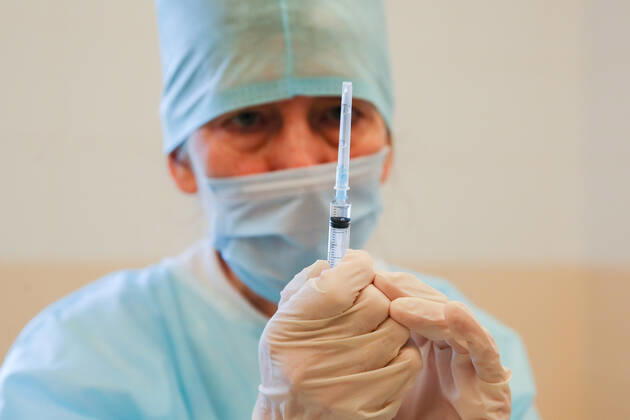 SOCHI, RUSSIA - FEBRUARY 1, 2021: A medical worker prepares a syringe during vaccination with the Gam-COVID-Vak (Sputnik V) vaccine against COVID-19 at Sochi s City Hospital No 4. Dmitry Feoktistov TASS  TS0F5AB2