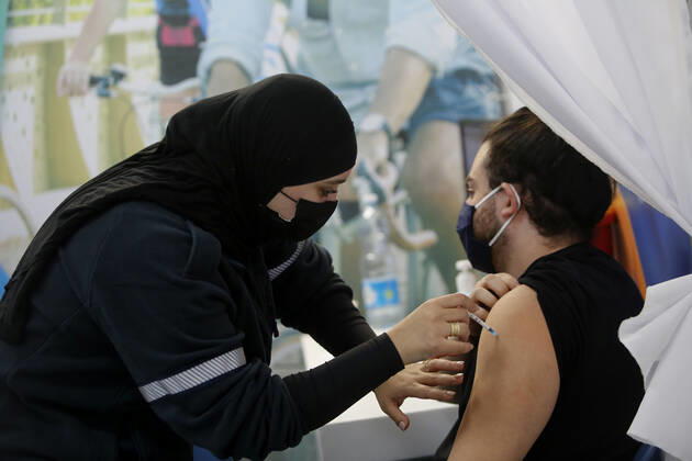 (210201) -- TEL AVIV, Feb. 1, 2021 -- A man receives the COVID-19 vaccine at a health service center in Tel Aviv, Israel, on Feb. 1, 2021. Israel s Ministry of Health reported 8,399 new COVID-19 cases on Monday, bringing the tally in the country to 651,405. The number of people vaccinated against the COVID-19 in Israel has surpassed 3.14 million, or 33.8 percent of its total population, since the vaccination campaign began on Dec. 20, 2020. (Photo by Xinhua) ISRAEL-TEL AVIV-COVID-19-VACCINATION GilxCohenxMagen
