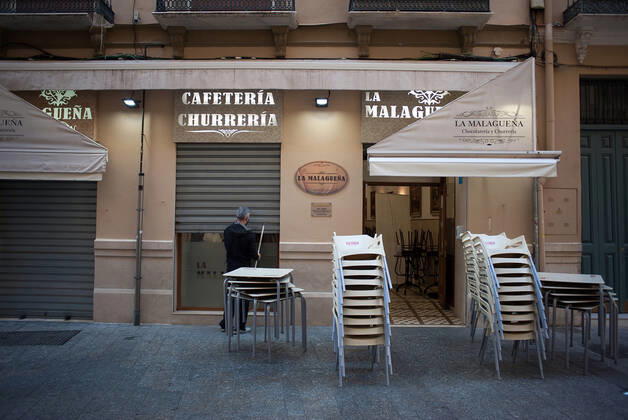 February 2, 2021, Malaga, Spain: A worker is seen closing La Malaguena coffee shop during the closure of the hospitality sector and non-essential activities as part of a partial lockdown..For two weeks, besides the limit on mobility between cities, many municipalities and Costa del Sol districts (including the Malaga capital) will have to close bars, restaurants and stores as measures to curb the spread of the coronavirus pandemic. In the lead of Andalusia, Malaga is the city with more daily coronavirus infections and a high rate of hospitalizations. Malaga Spain - ZUMAs197 20210202_zab_s197_011 Copyright: xJesusxMeridax