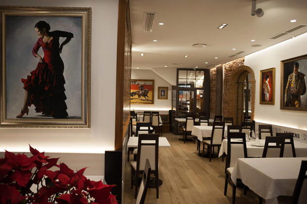 February 2, 2021, Malaga, Spain: An empty Lo gueno restaurant is seen decorated with paintings of flamenco and bullfighters during the closure of the hospitality sector and non-essential activities as part of a partial lockdown..For two weeks, besides the limit on mobility between cities, many municipalities and Costa del Sol districts (including the Malaga capital) will have to close bars, restaurants and stores as measures to curb the spread of the coronavirus pandemic. In the lead of Andalusia, Malaga is the city with more daily coronavirus infections and a high rate of hospitalizations. Malaga Spain - ZUMAs197 20210202_zab_s197_016 Copyright: xJesusxMeridax