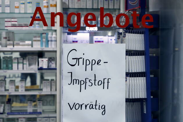 02 02 2021, Bonn, Germany Corona crisis photo flu vaccine available notice at a pharmacy