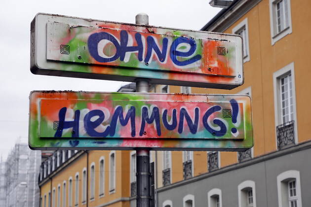 02 02 2021, Bonn, Germany Photo Without inhibition Graffiti on a street sign