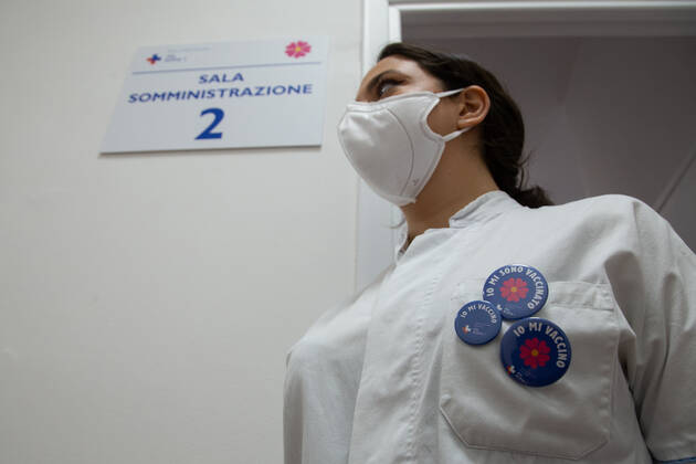 Italy: First COVID-19 vaccination for people over 80 in Rome Nurse with pins in favor of vaccination Rome Italy Copyright: MatteoxNardone