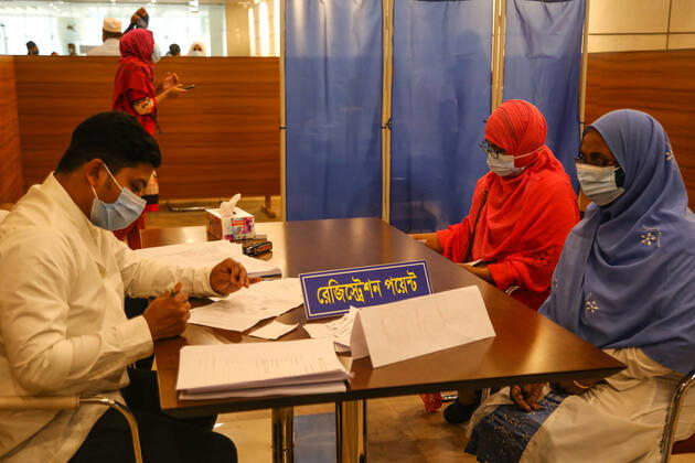 Bangladesh: Covid-19 vaccination drive begins in Dhaka Two women are doing registration to get vaccine. Dhaka Dhaka Division Bangladesh Copyright: NahidxHasan