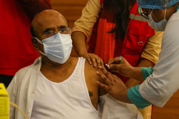Bangladesh: Covid-19 vaccination drive begins in Dhaka A man getting a shot with the dose of Covishield covid-19 vaccine during the vaccination drive. Dhaka Dhaka Division Bangladesh Copyright: NahidxHasan