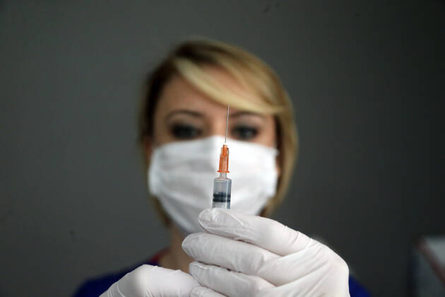 (210208) -- ANKARA, Feb. 8, 2021 -- A nurse prepares the COVID-19 vaccine at a health center in Ankara, Turkey, on Feb. 8, 2021. Turkey on Monday reported 8,103 new COVID-19 cases, including 632 symptomatic patients, as the total number of positive cases in the country reached 2,539,559, according to its health ministry. (Photo by Xinhua) TURKEY-ANKARA-COVID-19-VACCINATION MustafaxKaya 