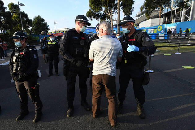 ANTI LOCKDOWN PROTEST MELBOURNE, A man tries to enter the Australian Open during an anti-lockdown protest in Melbourne, Friday, February 12, 2021. Victoria will enter a five-day lockdown from 11.59pm on Friday in an effort to contain an outbreak linked to a quarantine hotel. ( NO ARCHIVING, EDITORIAL USE ONLY, NO USE IN BOOKS WITHOUT CONSENT MELBOURNE VIC AUSTRALIA  Copyright: xERIKxANDERSONx 20210212001520069733