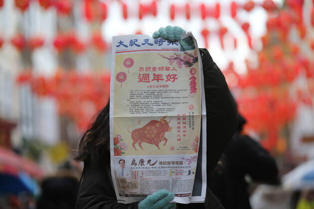 February 12, 2021, London, England, United Kingdom: A newspaper front page celebrating Chinese New Year is seen in Chinatown. The Lunar New Year marks the start of the Year of Ox. London United Kingdom - ZUMAs262 20210212_zip_s262_052 Copyright: xTayfunxSalcix