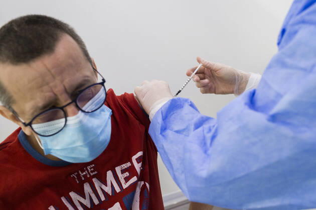 February 15, 2021, Timisoara, Timis, Romania: Man receives anti COVID-19 vaccine, produced by ASTRAZENECA, at a newly opened vaccination center in Timisoara. Timisoara Romania - ZUMAp180 20210215_zip_p180_006 Copyright: xCornelxPutanx