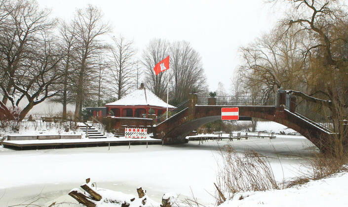 View of the snowy love island in the Hamburg city park Winterhude Hamburg