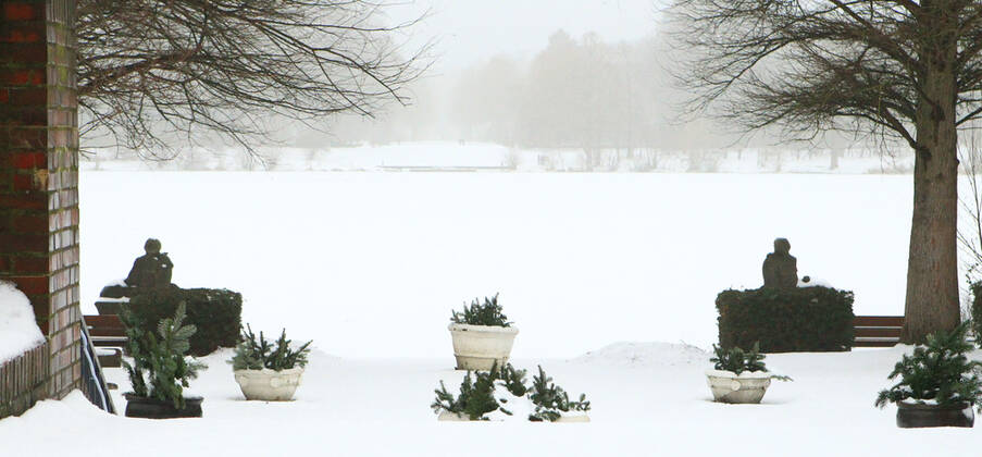 View of the frozen and snow-covered Stadtparksee in the Hamburg Stadtpark Winterhude Hamburg