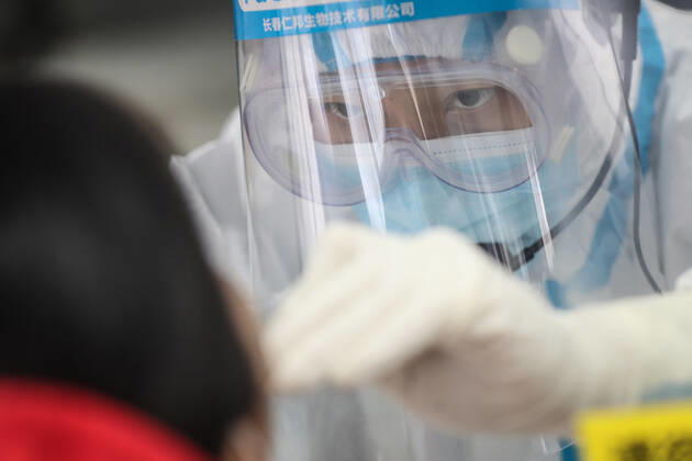 (210216) -- SHENYANG, Feb. 16, 2021 -- Sun Hewen, a medical worker with Shengjing Hospital of China Medical University, collects nucleic acid samples in Shenyang, capital of northeast China s Liaoning Province, Feb. 16, 2021. Since December last year, some areas in China s northeastern Heilongjiang, Jilin, and Liaoning Provinces reported newly confirmed COVID-19 cases. Related areas responded immediately according to epidemic prevention requirements. Mass nucleic acid testing were conducted in key areas in an effort to stem the spread of the coronavirus. Recently, no new confirmed COVID-19 cases have been reported here for several days. During the Spring Festival vacation, many workers stick to their posts to make sure we can celebrate the