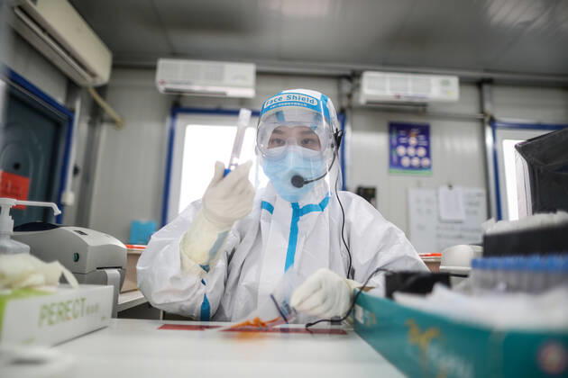 (210216) -- SHENYANG, Feb. 16, 2021 -- Sun Hewen, a medical worker with Shengjing Hospital of China Medical University, collects nucleic acid samples in Shenyang, capital of northeast China s Liaoning Province, Feb. 16, 2021. Since December last year, some areas in China s northeastern Heilongjiang, Jilin, and Liaoning Provinces reported newly confirmed COVID-19 cases. Related areas responded immediately according to epidemic prevention requirements. Mass nucleic acid testing were conducted in key areas in an effort to stem the spread of the coronavirus. Recently, no new confirmed COVID-19 cases have been reported here for several days. During the Spring Festival vacation, many workers stick to their posts to make sure we can celebrate the