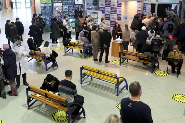 YEKATERINBURG, RUSSIA - FEBRUARY 17, 2021: Citizens queue outside a mobile COVID-19 vaccination unit set up at the Dirizhabl Airship shopping centre, injections of the Gam-COVID-Vac (Sputnik-V) free of charge, no prior appointment required. Donat Sorokin TASS  TS0F7014