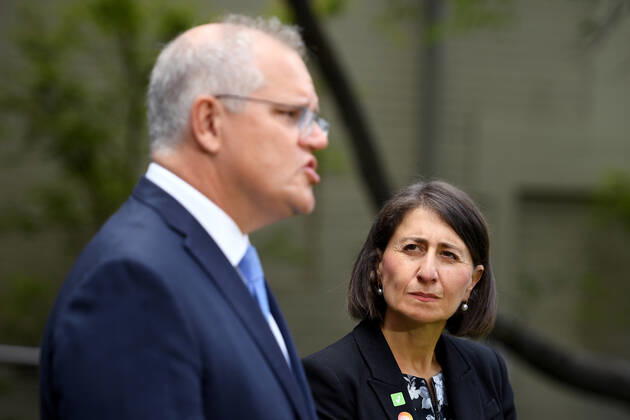 SCOTT MORRISON VACCINE HOSPITAL TOUR, NSW Premier Gladys Berejiklian looks on as Prime Minister Scott Morrison addresses media following a tour of a COVID-19 vaccination hub at Royal Prince Alfred hospital in Sydney, Friday, February 19, 2021. The first COVID-19 vaccinations in NSW will take place on Monday, with the Pfizer jab to go out to frontline workers. ( NO ARCHIVING, EDITORIAL USE ONLY, NO USE IN BOOKS WITHOUT CONSENT Sydney NSW AUSTRALIA  Copyright: xDANxHIMBRECHTSx 20210219001521595162