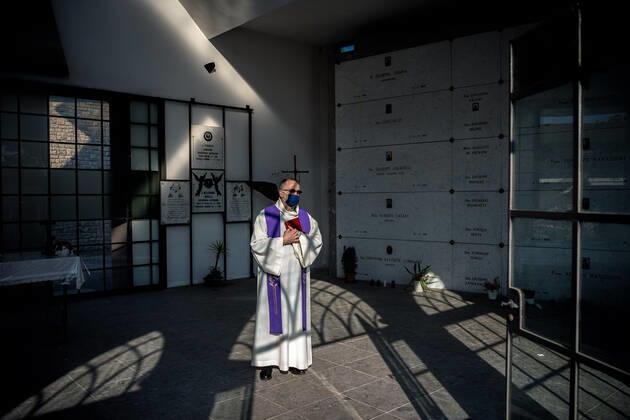 Ponte San Pietro, Bergamo. A priest in the cemetery of the town of Ponte San Pietro Editorial Usage Only  Copyright: xCarloxCozzolix xIPAx