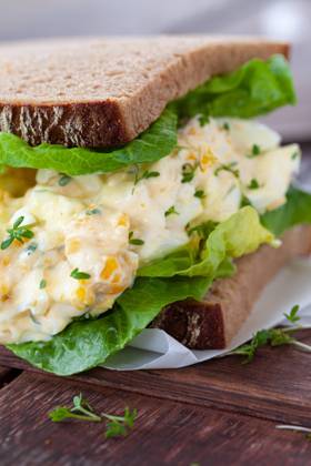 Rustic topped bread with egg salad and fresh salad 1079706510