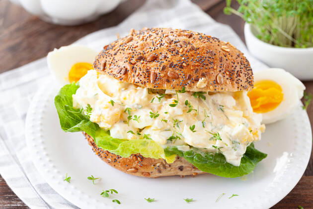 Rustic wholemeal bread with egg salad and fresh salad 1079706511