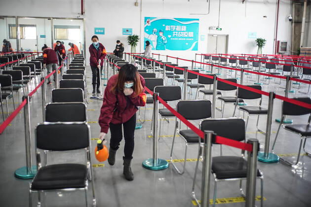 (210221) -- BEIJING, Feb. 21, 2021 -- Staff members disinfect the observation area of a COVID-19 vaccination site in Daxing District of Beijing, capital of China, Feb. 21, 2021. Daxing District of Beijing has launched a local mass vaccination drive on Feb. 17, setting up 26 sites in the region for the mass vaccination. ) CHINA-BEIJING-DAXING-COVID-19-VACCINATION (CN) PengxZiyang 