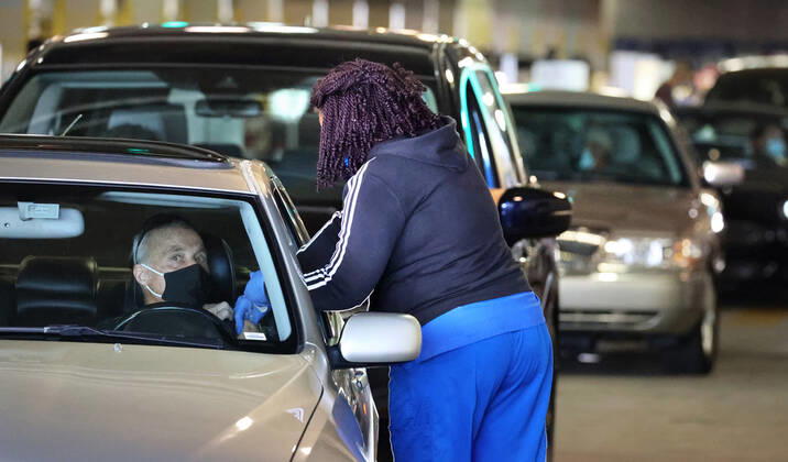 February 22, 2021, Orlando, FL, USA: A Florida resident gets vaccinated at the drive-thru site at the Orange County Convention Center in Orlando, Monday, February 22, 2021. The Florida Department of Health continues to administer COVID-19 vaccinations at the convention center s North Concourse. Additional FEMA vaccination sites will open starting next week in Orlando and two other Florida cities. Orlando USA - ZUMAm67_ 20210222_zaf_m67_015 Copyright: xJoexBurbankx