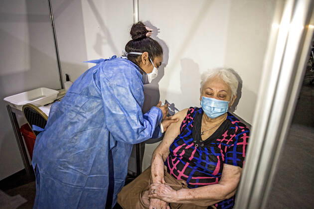 February 22, 2021, Buenos Aires, Federal Capital, Argentina: The Government of the City of Buenos Aires began this morning with the second stage of the vaccination plan against COVID-19. The first delivery of 40,000 Oxford-AstraZeneca Covishield vaccines, manufactured in India, will be aimed at adults over 80 years of age and those residing in nursing homes. To begin with, this Monday is scheduled to serve approximately 5,000 people..Mrs. Norida, 82, of Venezuelan nationality, with permanent residence in the City of Buenos Aires, receives the Covishield vaccine Buenos Aires Argentina - ZUMAa179 20210222_zap_a179_001 Copyright: xRobertoxAlmeidaxAveledox