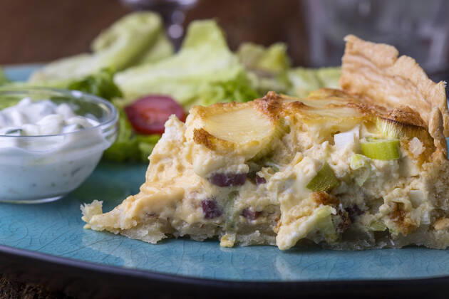French Quiche Lorraine with salad on wood 1035308197