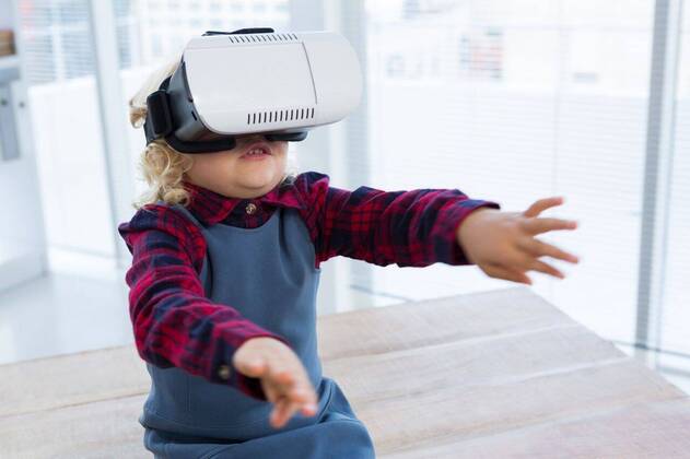 Businesswoman looking through virtual reality simulator while sitting on table Businesswoman looking through virtual reality simulator while sitting on table in office, model released, Cape Town, South Africa, 2017-04-12T23:00:00.000Z, 1050488.jpg, business person, virtual reality simulator, sitting, table, office, childhood, innocence, cute, smart casual, workplace, business, profession, occupation, confidence, designer, creative, fashion, design professional, wooden, wood, technology, wireless, wearable computer, computer, exploration, futuristic, discovery, innovation, wireless technology, virtual reality, gesturing, arms raised, businesswoman, well dressed, smart, elegant, classy, stylish, imagination, aspirations, adult imitation, i