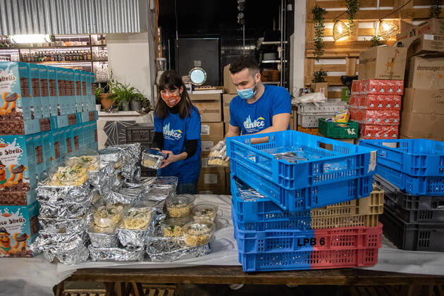 (210222) -- PARIS, Feb. 22, 2021 -- Volunteers prepare free food for people in precarious situations during the COVID-19 pandemic in Paris, France, on Feb. 22, 2021. (Photo by Xinhua) FRANCE-PARIS-COVID-19-FREE FOOD-DISTRIBUTION AurelienxMorissard